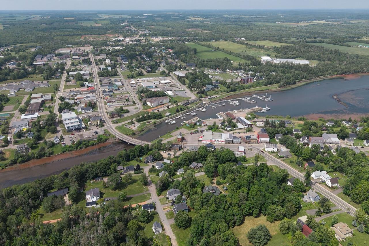 Downtown Montague from the air, with the commercial streets between the fields and the river marina
